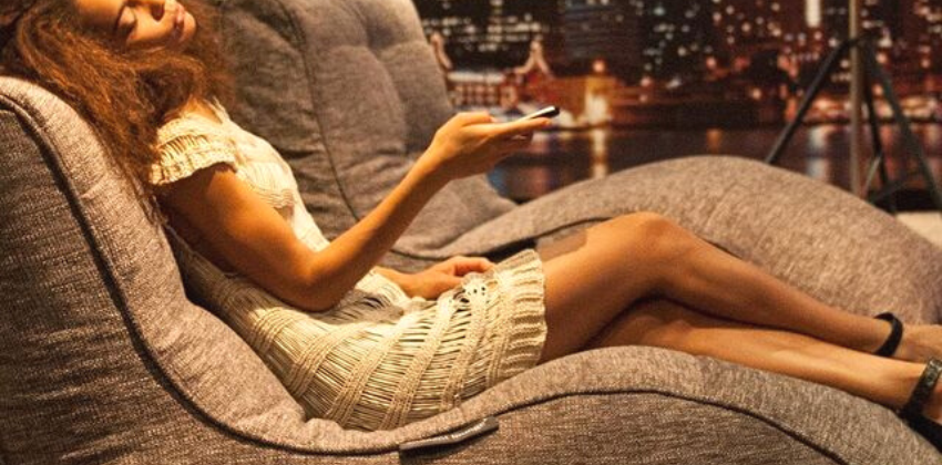 a woman lying on an ambient lounge avatar lounger